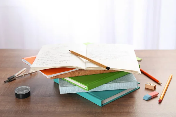 Pile of homework on table — Stock Photo, Image