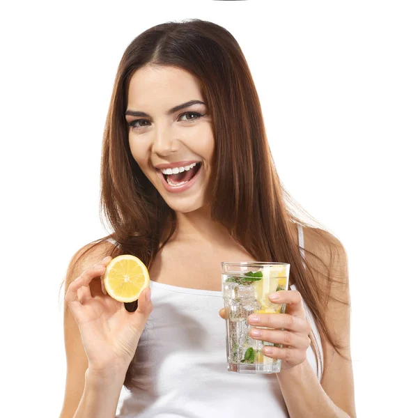 Beautiful young woman with glass of lemonade on white background — Stock Photo, Image