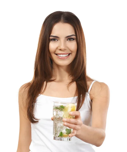 Beautiful young woman with glass of lemonade on white background — Stock Photo, Image