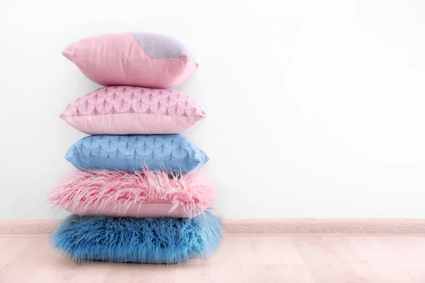 Pillows on wooden floor — Stock Photo, Image