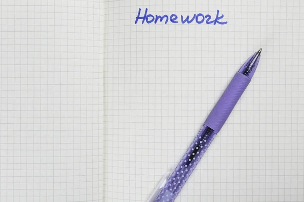 Exercise book with word "Homework", closeup — Stock Photo, Image
