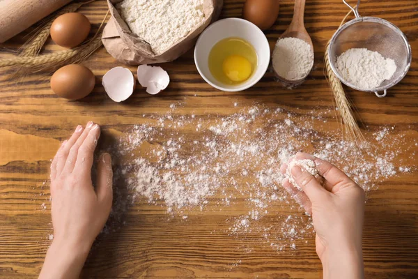 Woman Sprinkling Table Flour Top View — Stock Photo, Image