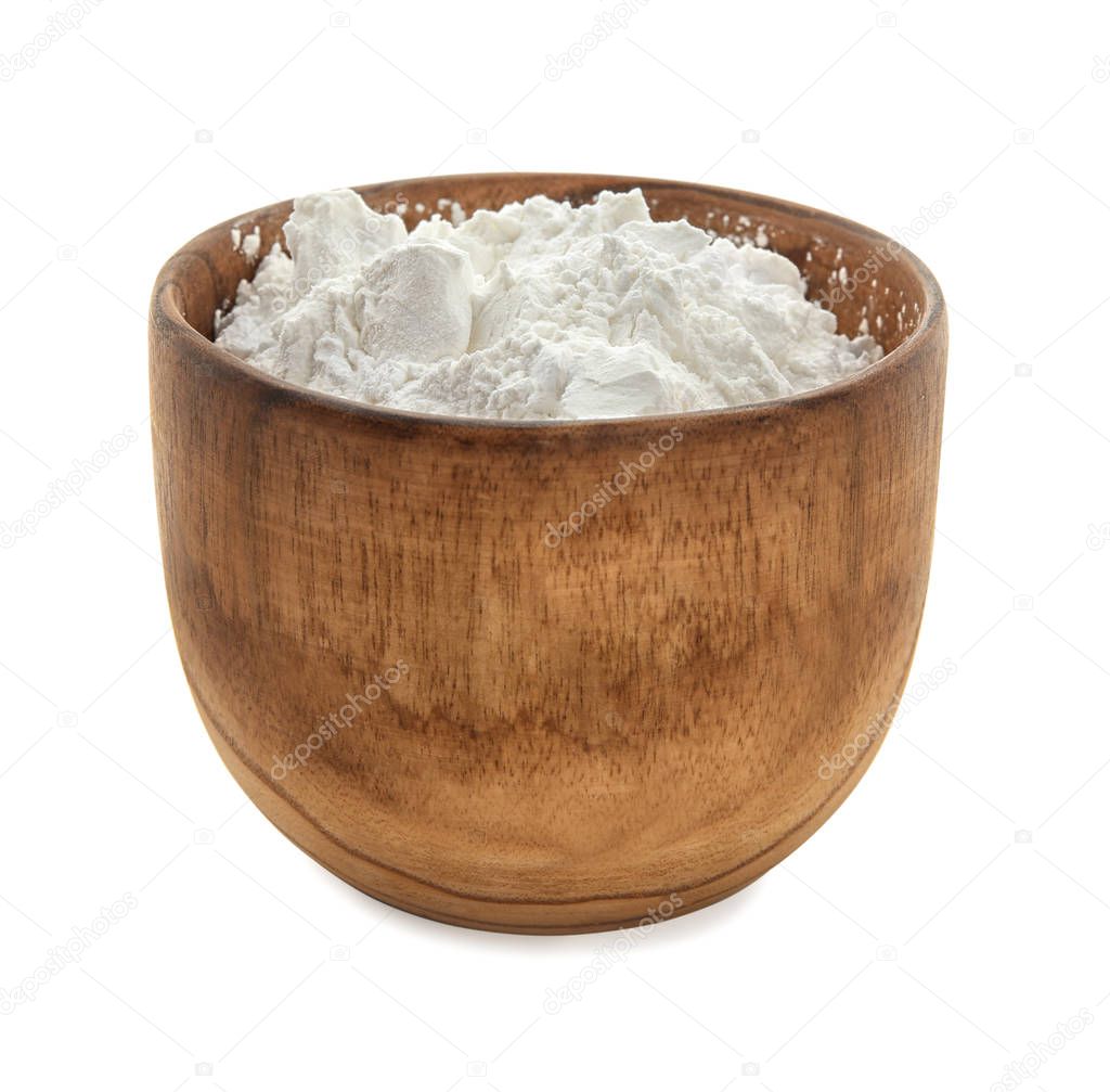 Wooden bowl with corn starch on white background