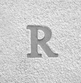 Silueta písmeno R na rozptýlené mouky