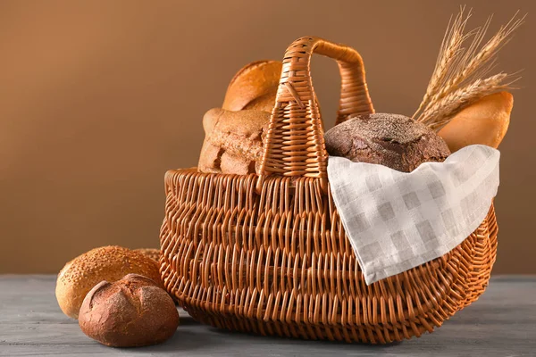 Wicker Basket Different Bread Wooden Table — Stock Photo, Image