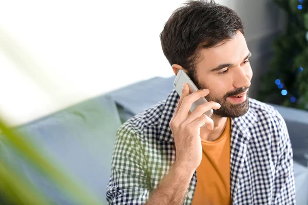 Young Man Talking Mobile Phone Indoors — Stock Photo, Image