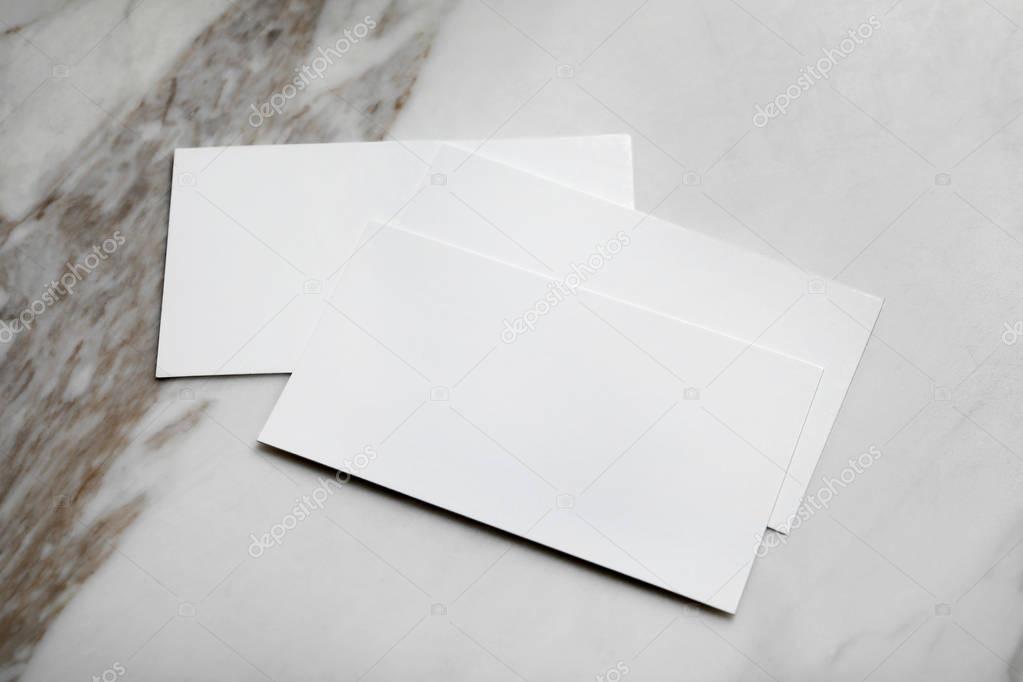 Blank business cards on light background