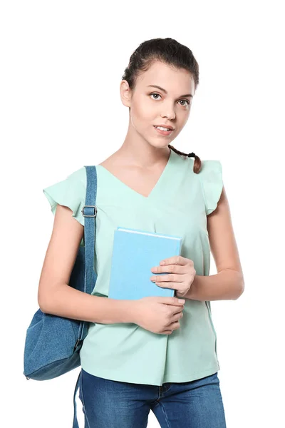 A hátizsák és a könyv, elszigetelt fehér tizenéves lány — Stock Fotó