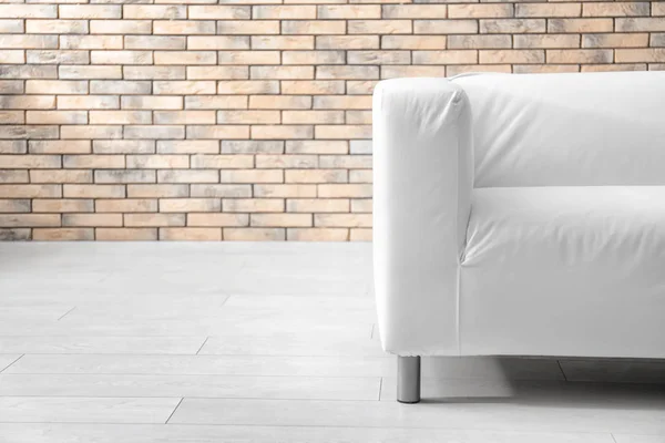 Stylish Sofa Brick Wall Indoors — Stock Photo, Image