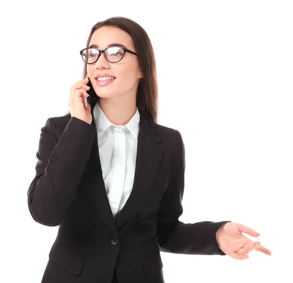 Beautiful young woman in elegant suit talking by mobile phone on white background — Stock Photo, Image