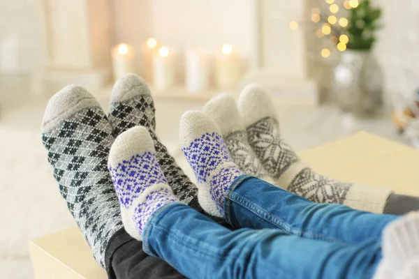 Family relaxing at home on winter vacation