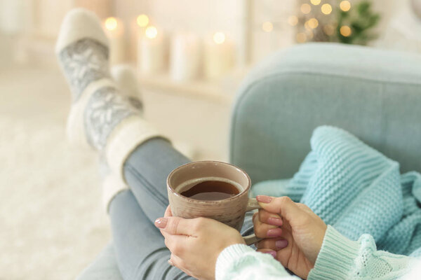 Woman relaxing at home on winter vacation