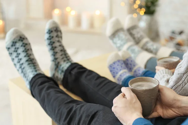 Family relaxing at home on winter vacation