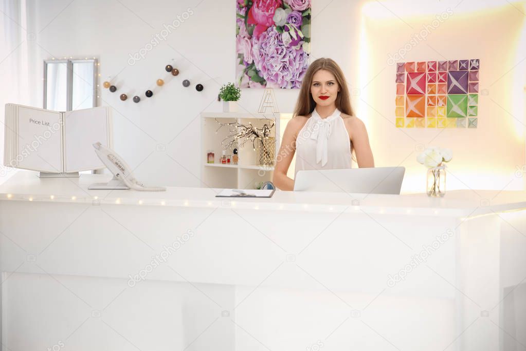 Beauty salon receptionist at workplace