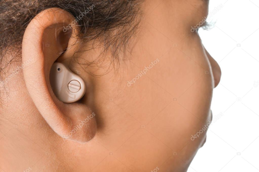 Little girl with hearing aid, closeup