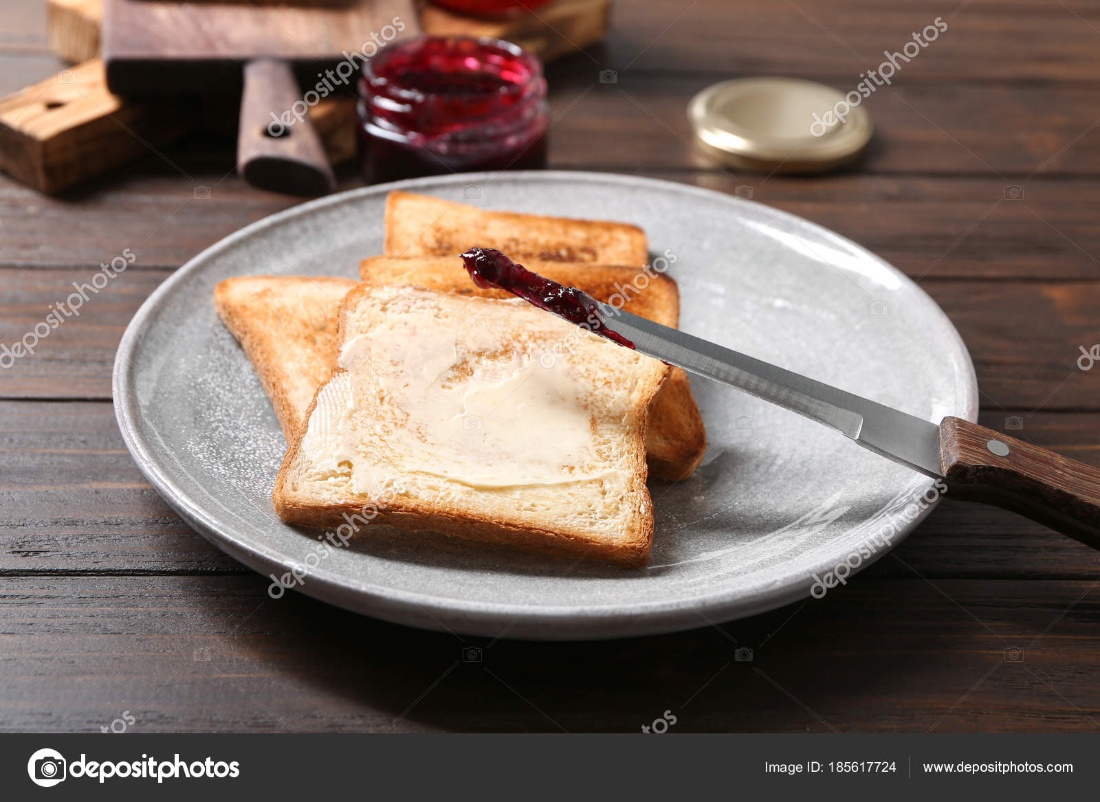 Plate With Tasty Toasted Bread Butter And Jam On Table Stock Photo Image By C Belchonock