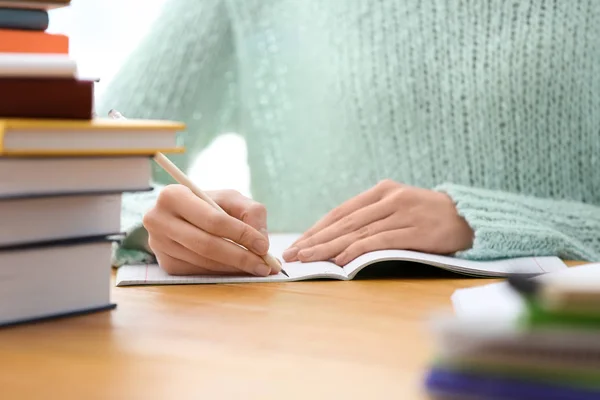 Student preparing assignment at table, closeup. Studying process — Stock Photo, Image