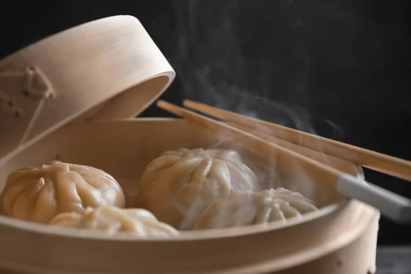 Bamboo steamer with baozi dumplings, closeup