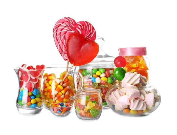 Glassware with colorful candies on white background — Stock Photo, Image