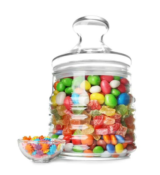 Glass jar with different colorful candies on white background — Stock Photo, Image