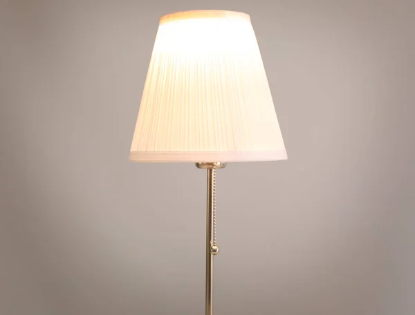 Stylish lamp on light background