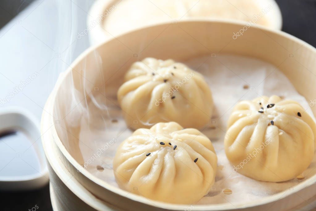 Bamboo steamer with baozi dumplings, closeup