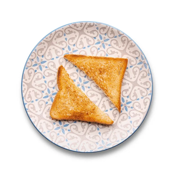 Prato com saboroso pão torrado sobre fundo branco — Fotografia de Stock