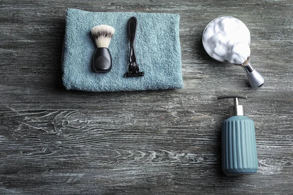 Shaving accessories for man on wooden background