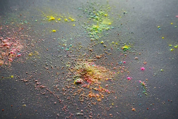 Colorful powders for Holi festival on dark background — Stock Photo, Image