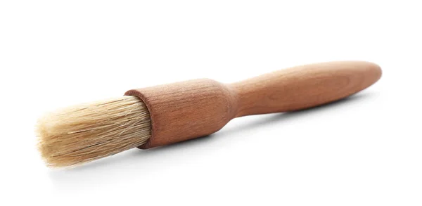 Кисть з дерев'яною ручкою на білому тлі. Кухонне начиння ручної роботи — стокове фото