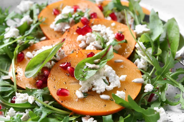 Tasty persimmon with cottage cheese and arugula, closeup — Stock Photo, Image