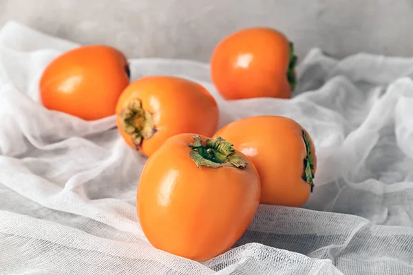 Tasty ripe persimmons — Stock Photo, Image