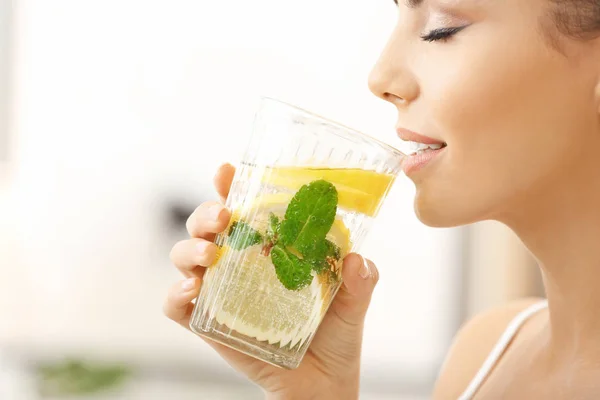 young woman drinking lemonade