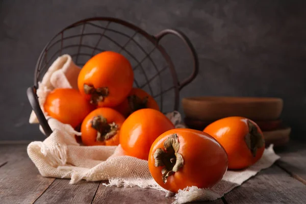 Tasty ripe persimmons — Stock Photo, Image