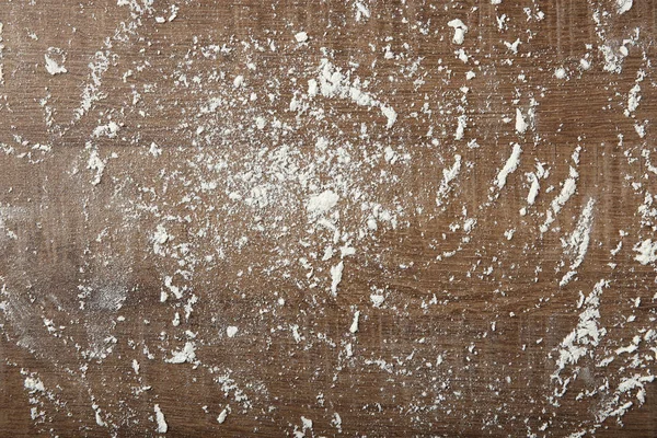 Scattered flour on wooden background — Stock Photo, Image