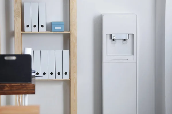 Modern water cooler in office