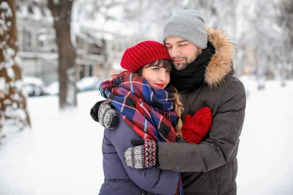 Portrait of young loving couple outdoors on winter day — Stock Photo, Image