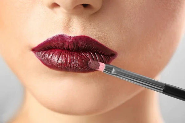 Woman applying makeup, closeup. Professional visage artist work — Stock Photo, Image