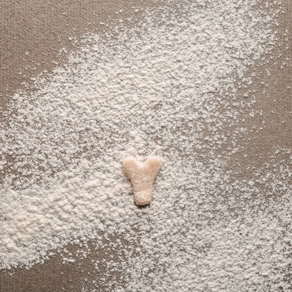 Letter Y made of raw dough on flour — Stock Photo, Image