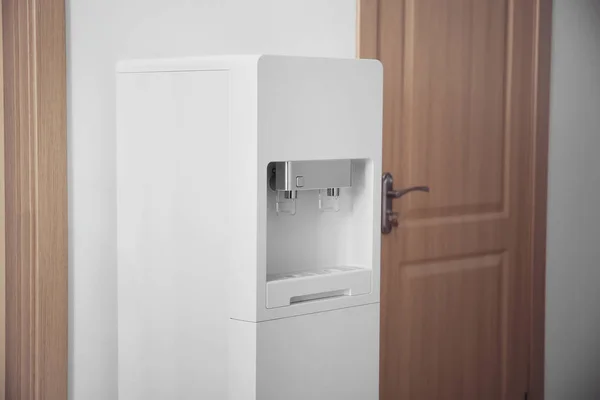 Modern water cooler near door — Stock Photo, Image