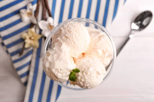 Glass with delicious vanilla ice cream on table — Stock Photo, Image