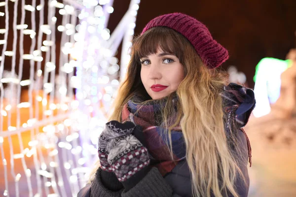 Portrait of beautiful young woman outdoors on Christmas eve — Stock Photo, Image