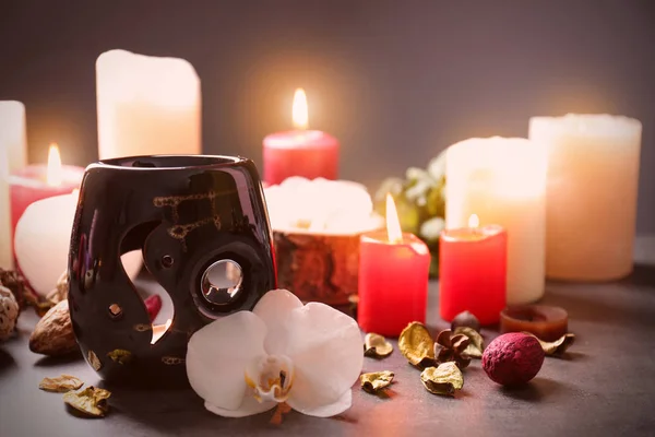 Aroma lamp and candles on table — Stock Photo, Image