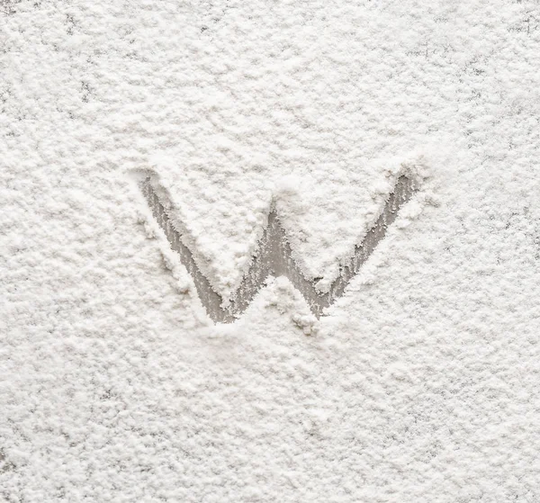 Letter W written on flour — Stock Photo, Image