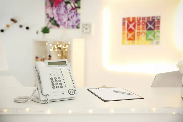 Telephone on reception desk in beauty salon