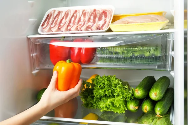 Young Woman Taking Fresh Pepper Refrigerator — Stock Photo, Image