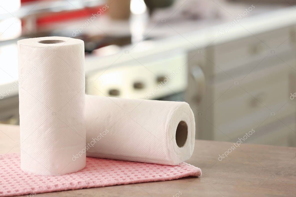 Rolls of paper towels on kitchen table