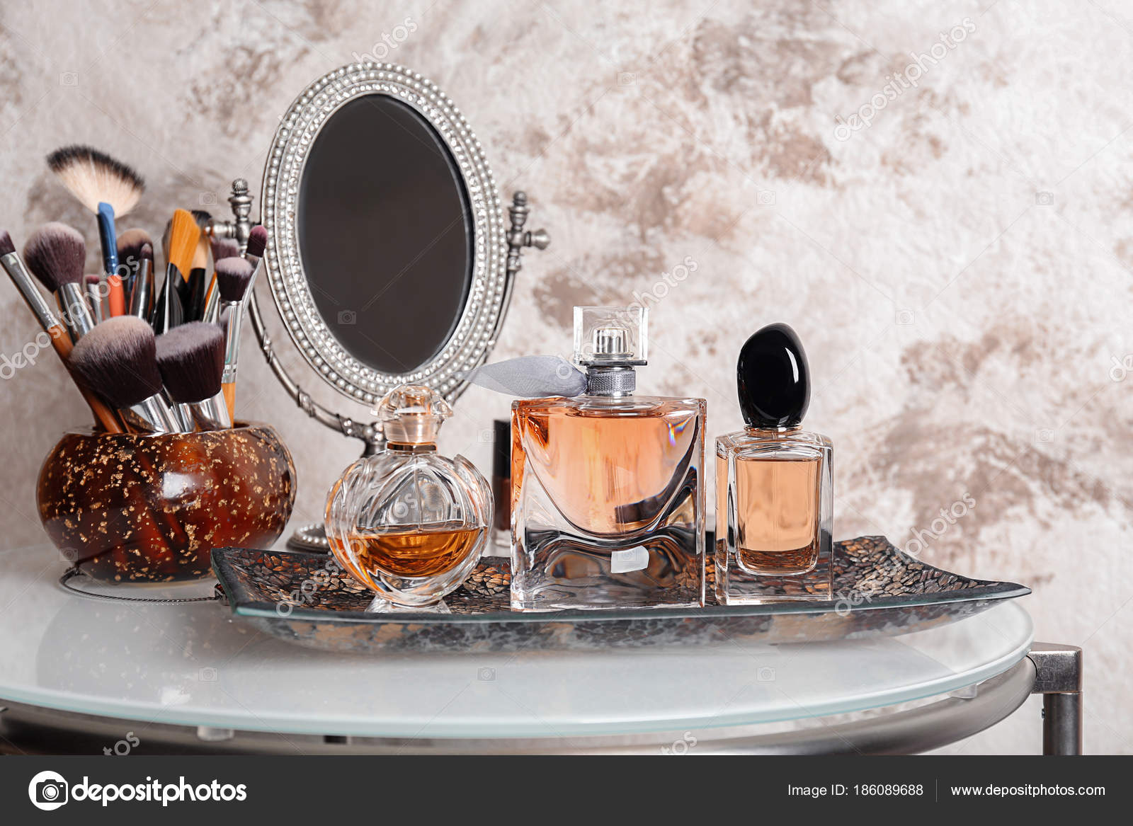 A bottle of perfume sitting on top of a table photo – Free Perfume