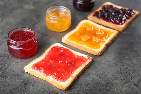 Delicious Toasts Various Sweet Jams Grey Background — Stock Photo, Image