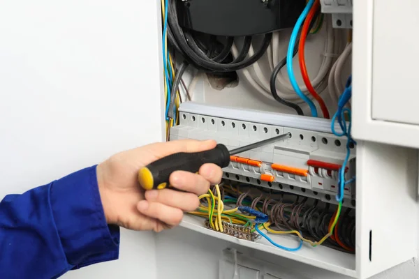 Young Electrician Repairing Distribution Board Closeup — Stock Photo, Image